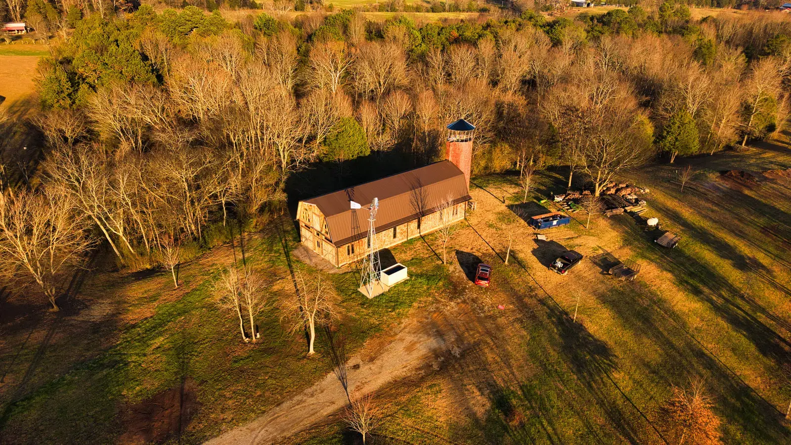 Aerial view of a rustic building and tower surrounded by a Tennessee landscape
